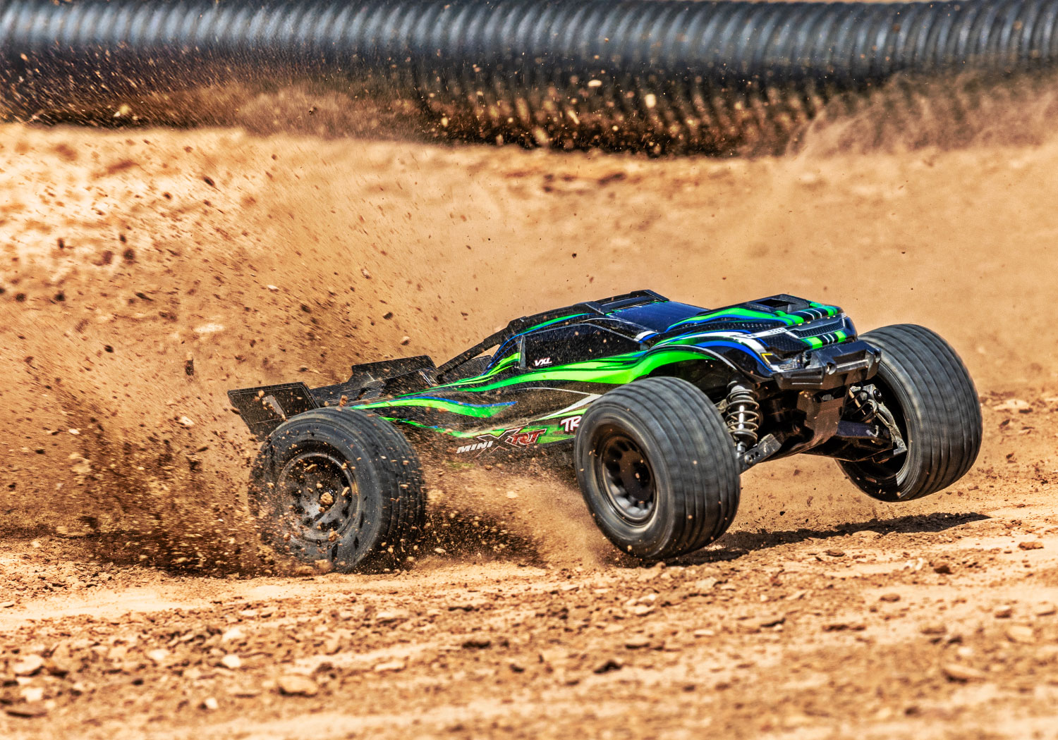 An action shot of the Mini XRT Ready to Run with Battery and Charger (Blue) (TRA108076-1-BLUE).