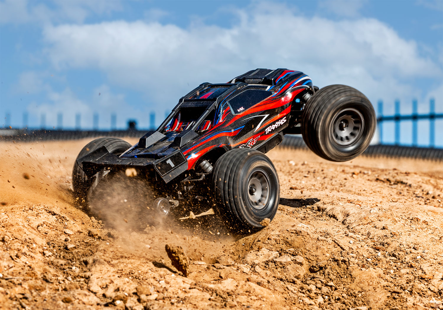 An action shot of the Mini XRT Ready to Run with Battery and Charger (Blue) (TRA108076-1-BLUE).