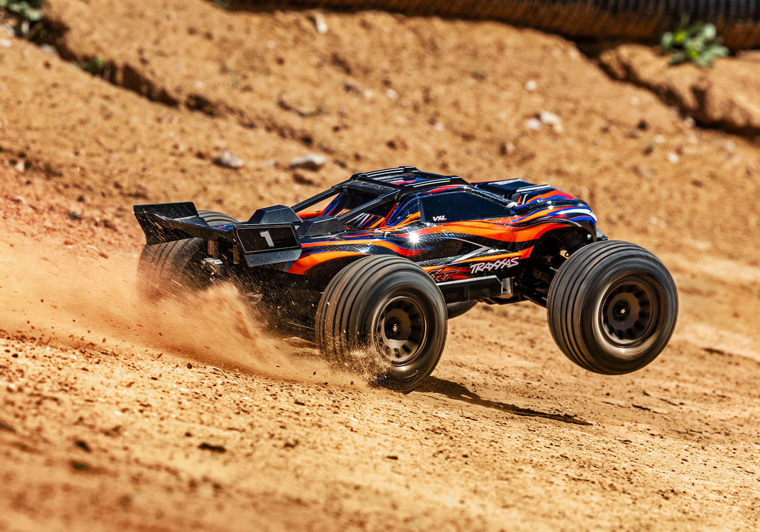 An action shot of the Mini XRT Ready to Run with Battery and Charger (Blue) (TRA108076-1-BLUE).