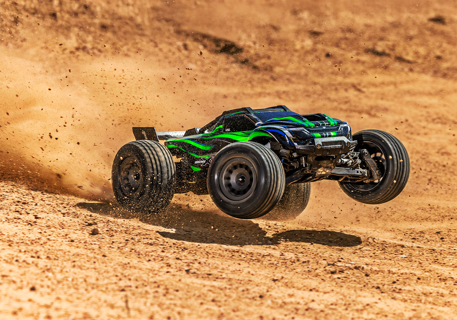 An action shot of the Mini XRT Ready to Run with Battery and Charger (Blue) (TRA108076-1-BLUE).