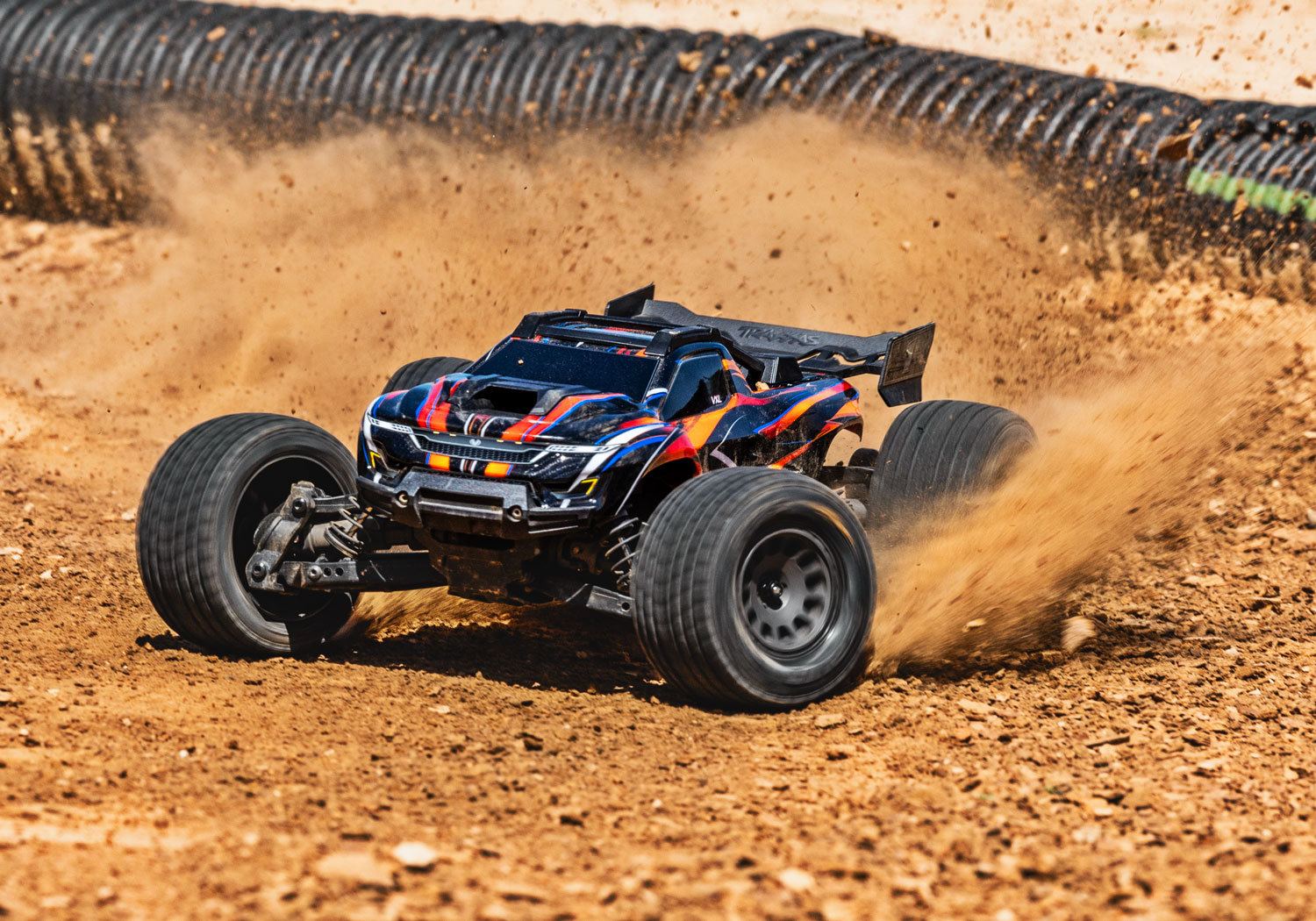 An action shot of the Mini XRT Ready to Run with Battery and Charger (Blue) (TRA108076-1-BLUE).