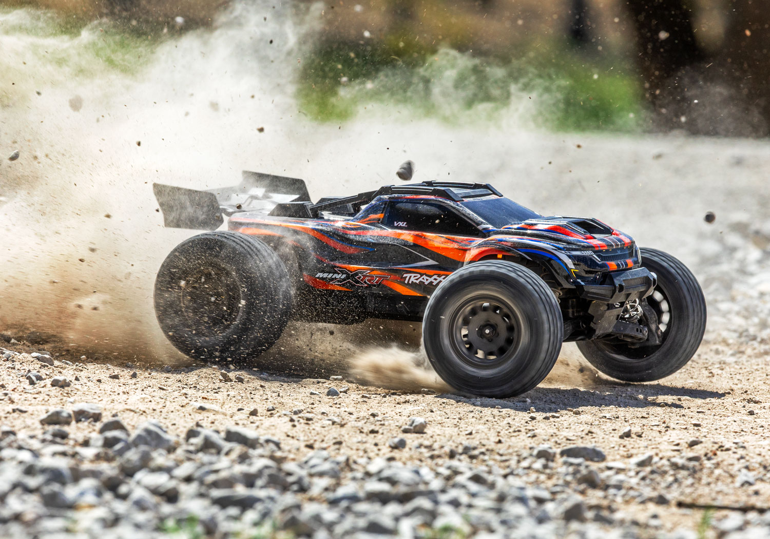 An action shot of the Mini XRT Ready to Run with Battery and Charger (Blue) (TRA108076-1-BLUE).