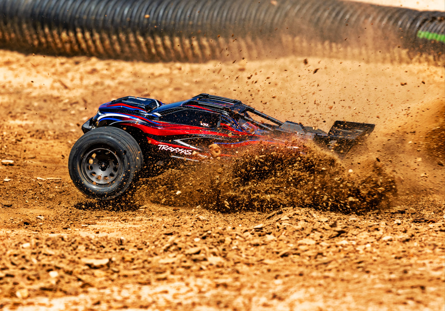 An action shot of the Mini XRT Ready to Run with Battery and Charger (Blue) (TRA108076-1-BLUE).