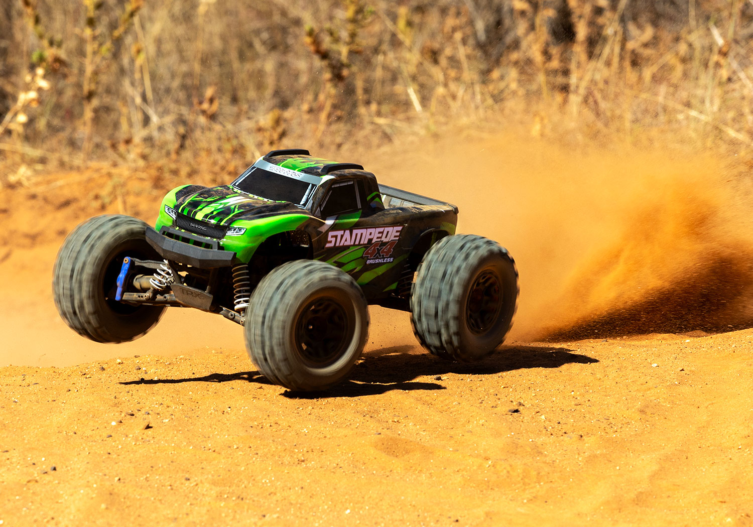 An action shot of the 1/10 Stampede 4x4 BL-2S Ready to Run (Green) (TRA67154-4-GRN).