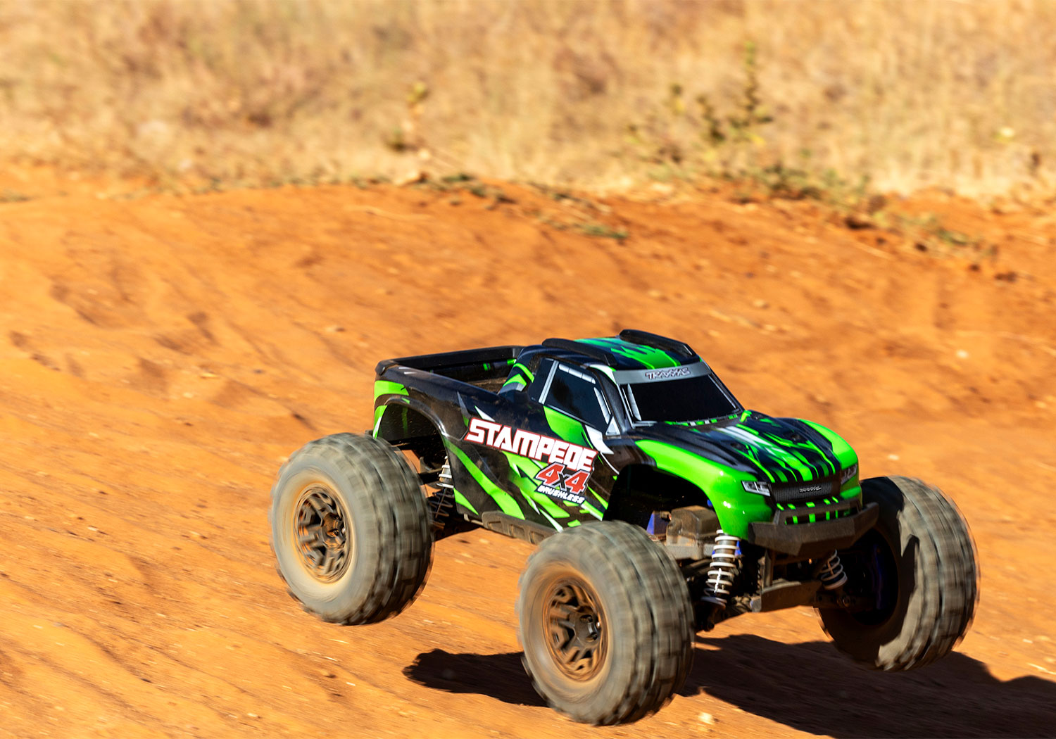 An action shot of the 1/10 Stampede 4x4 BL-2S Ready to Run (Green) (TRA67154-4-GRN).