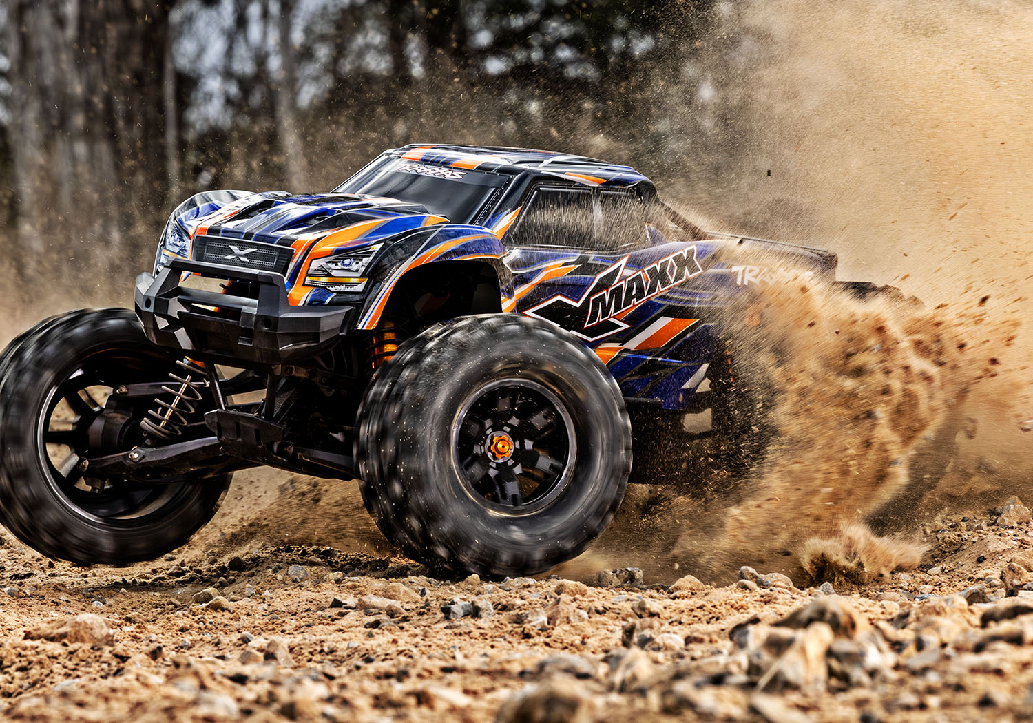 An action shot of the X-Maxx 8S with Belted Sledgehammer Tires (Green) (TRA77096-4-GRN).