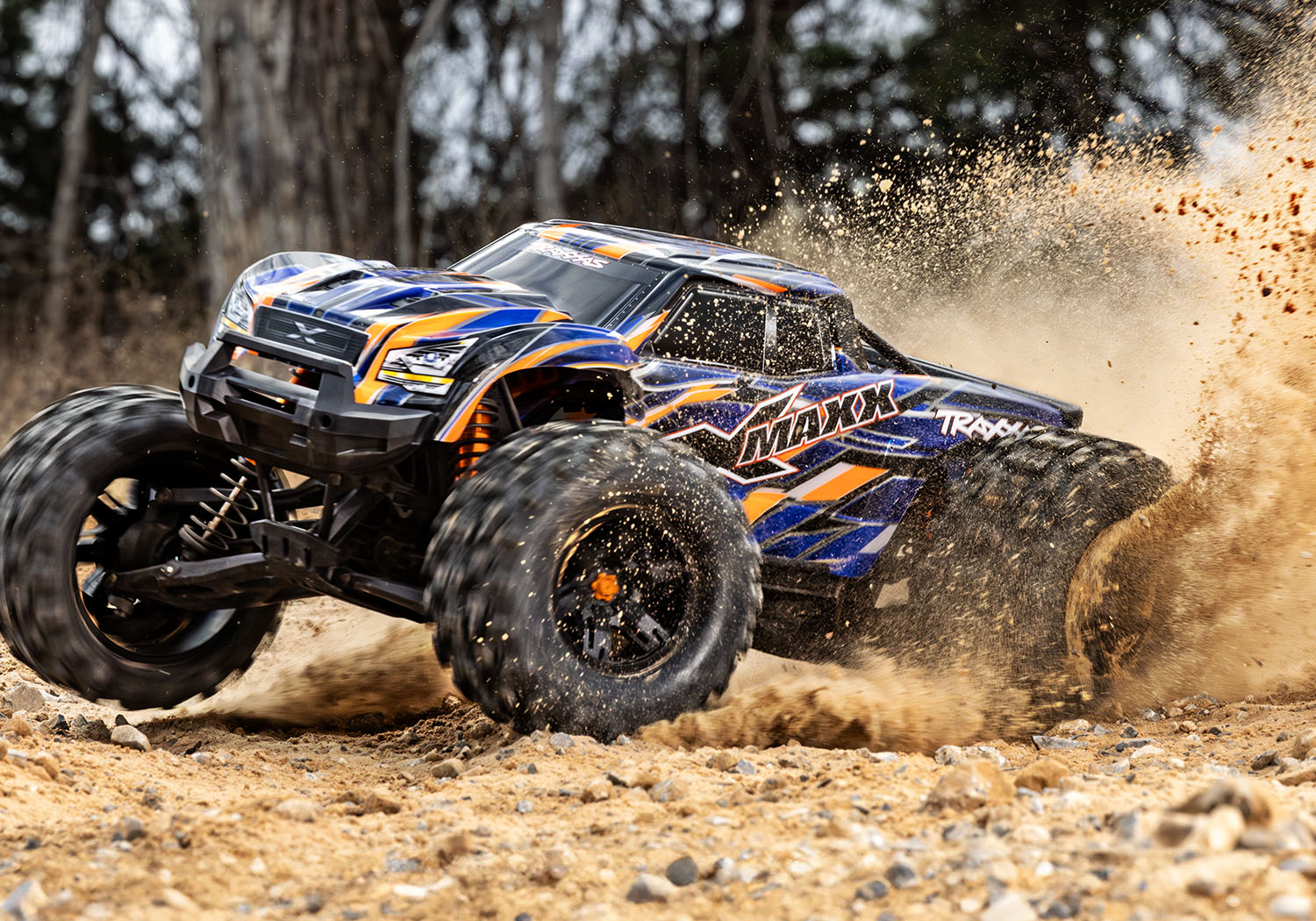 An action shot of the X-Maxx 8S with Belted Sledgehammer Tires (Green) (TRA77096-4-GRN).