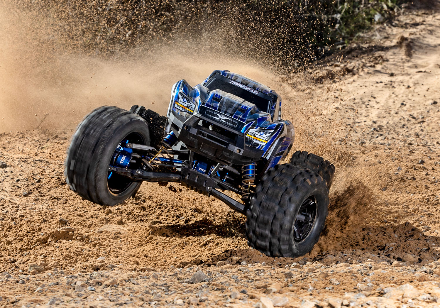An action shot of the X-Maxx 8S Ultimate Ready to Run (Blue) (TRA77097-4-BLUE).