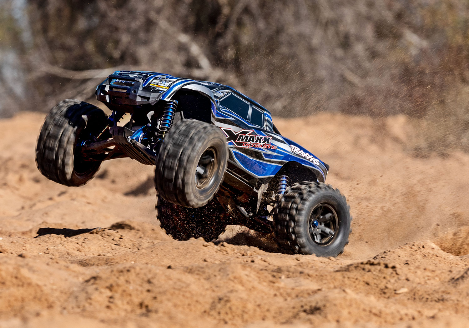 An action shot of the X-Maxx 8S Ultimate Ready to Run (Blue) (TRA77097-4-BLUE).