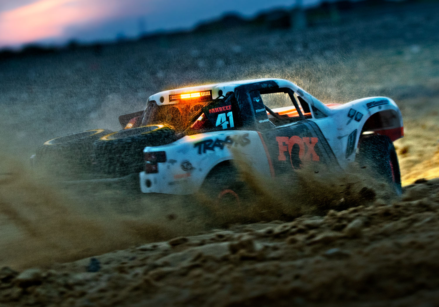 An action shot of the 1/7 Unlimited Desert Racer Ready to Run (Rigid) (TRA85086-4-RGD).