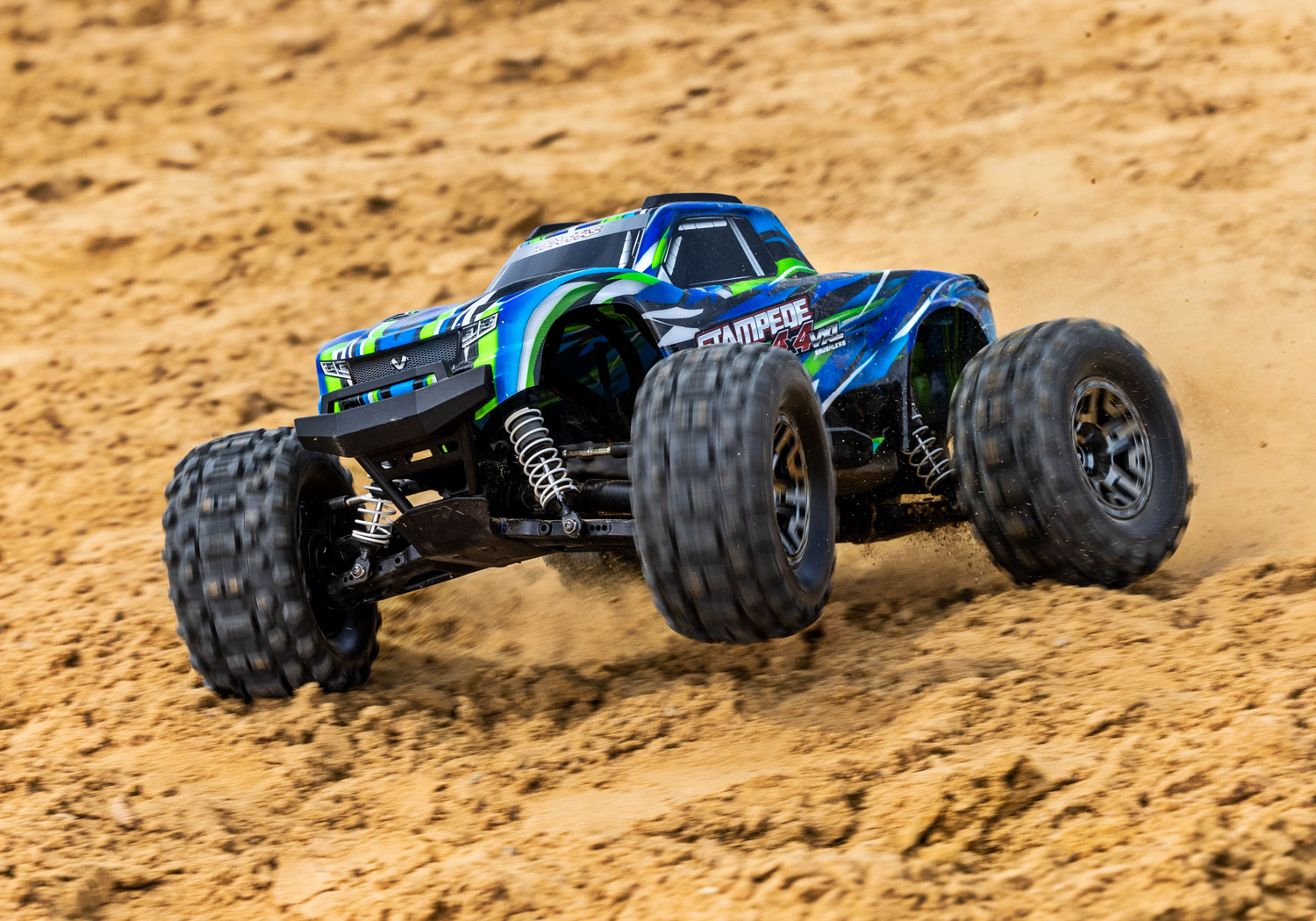 An action shot of the 1/10 Stampede 4x4 VXL with 540XL Motor Ready to Run (Orange) (TRA90376-4-ORNG).