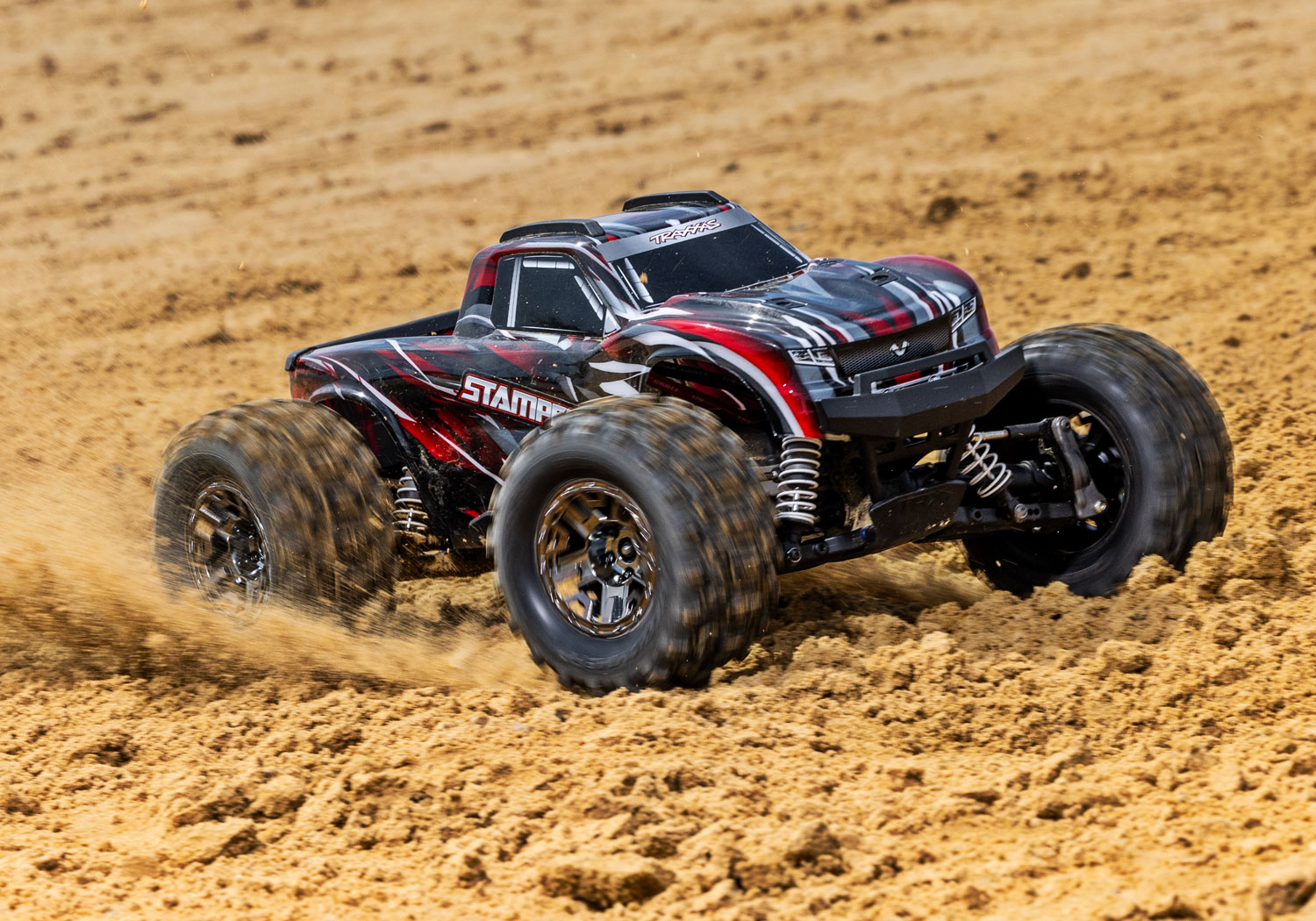 An action shot of the 1/10 Stampede 4x4 VXL with 540XL Motor Ready to Run (Red) (TRA90376-4-RED).