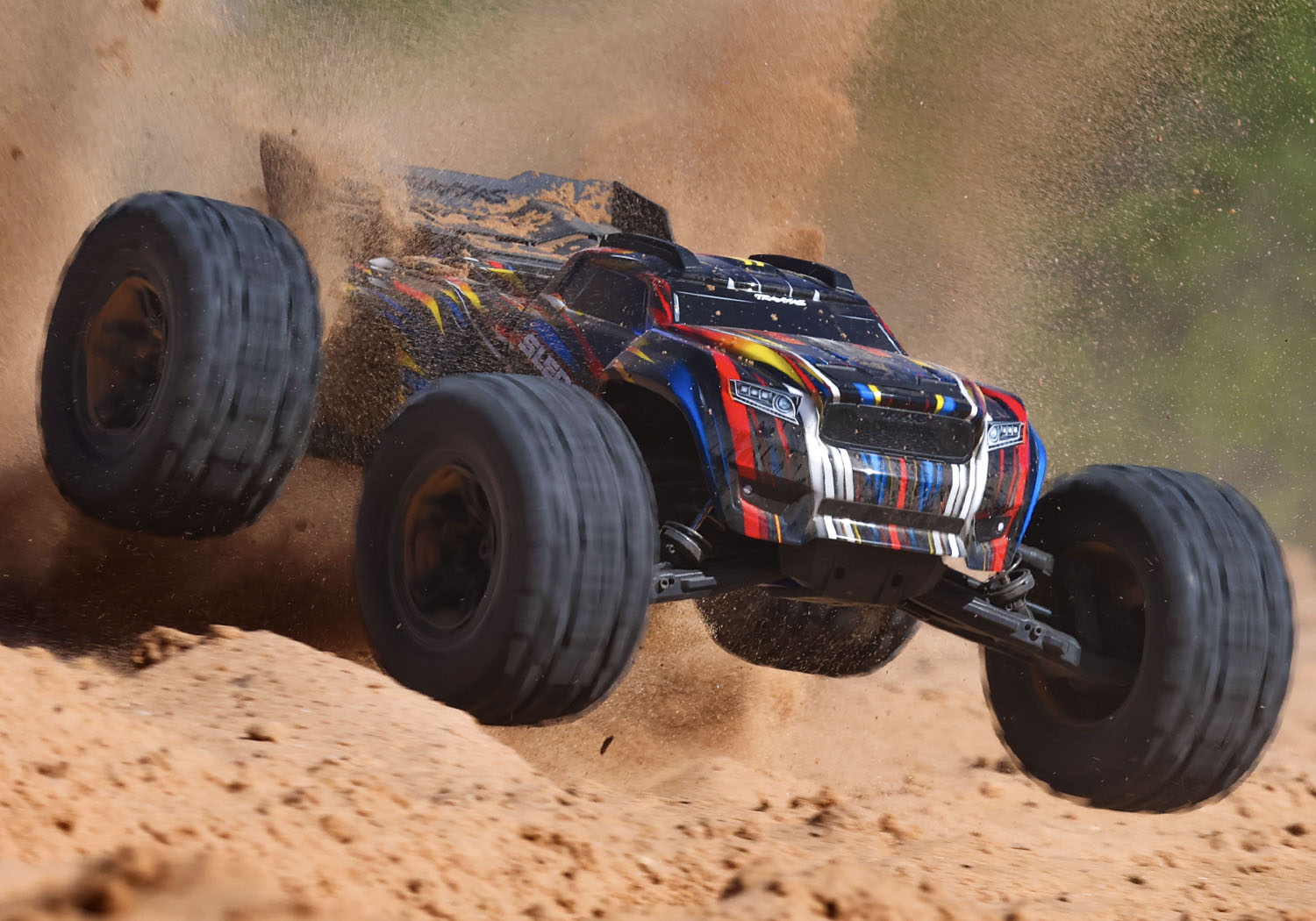 An action shot of the 1/8 Sledge with Belted Sledgehammer Tires Ready to Run (Blue) (TRA95096-4-BLUE).